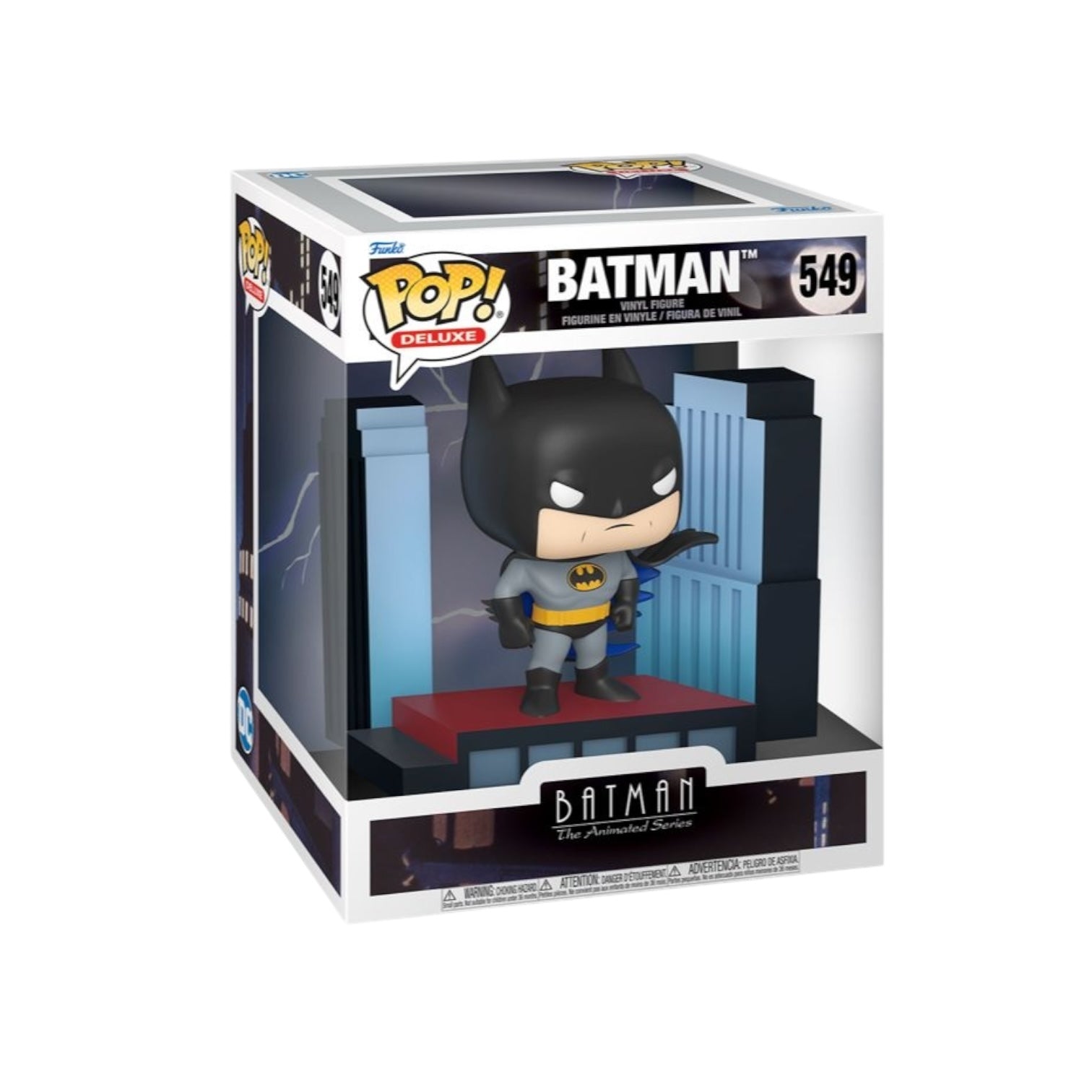 Batman deluxe pop animated batman standing on a building in gotham city 